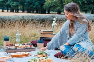 Woman sitting on a picnic spot