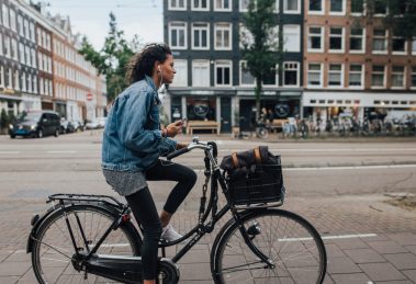 woman cycling in a city