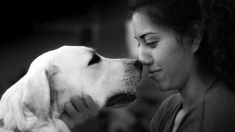 black and white photo of woman and dog