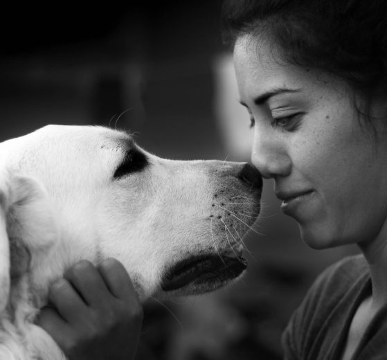 black and white photo of woman and dog