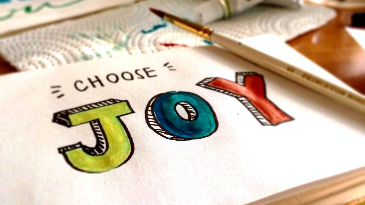 a watercolor paper with choose joy